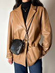 Vintage tan leather jacket with hand-stitched detailing by Claude Collections