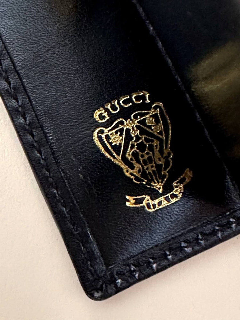 Portachiavi trifold Gucci in pelle nera con logo in metallo oro e scatola originale