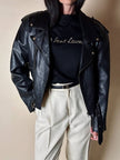 Maglia vintage Yves Saint Laurent in cotone nero con firma ricamata e bottoni dorati