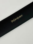 Cintura vintage Yves Saint Laurent in camoscio nero con maxi fibbia oro logata YSL