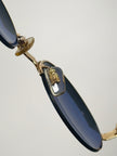 Occhiali da sole vintage Oliver Valentino con montatura gioiello dorata e lenti blu