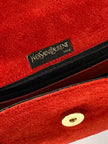 Borsa vintage Yves Saint Laurent in camoscio rosso con passamaneria nera