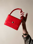 Mini bag vintage Versace Profumi in raso rosso con borchia medusa