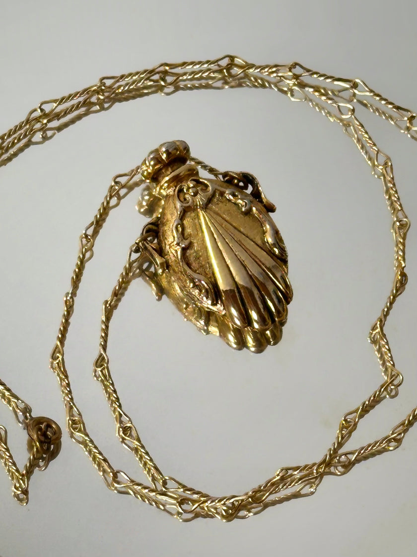 Collana vintage dorata con ciondolo a forma di bottiglia di profumo