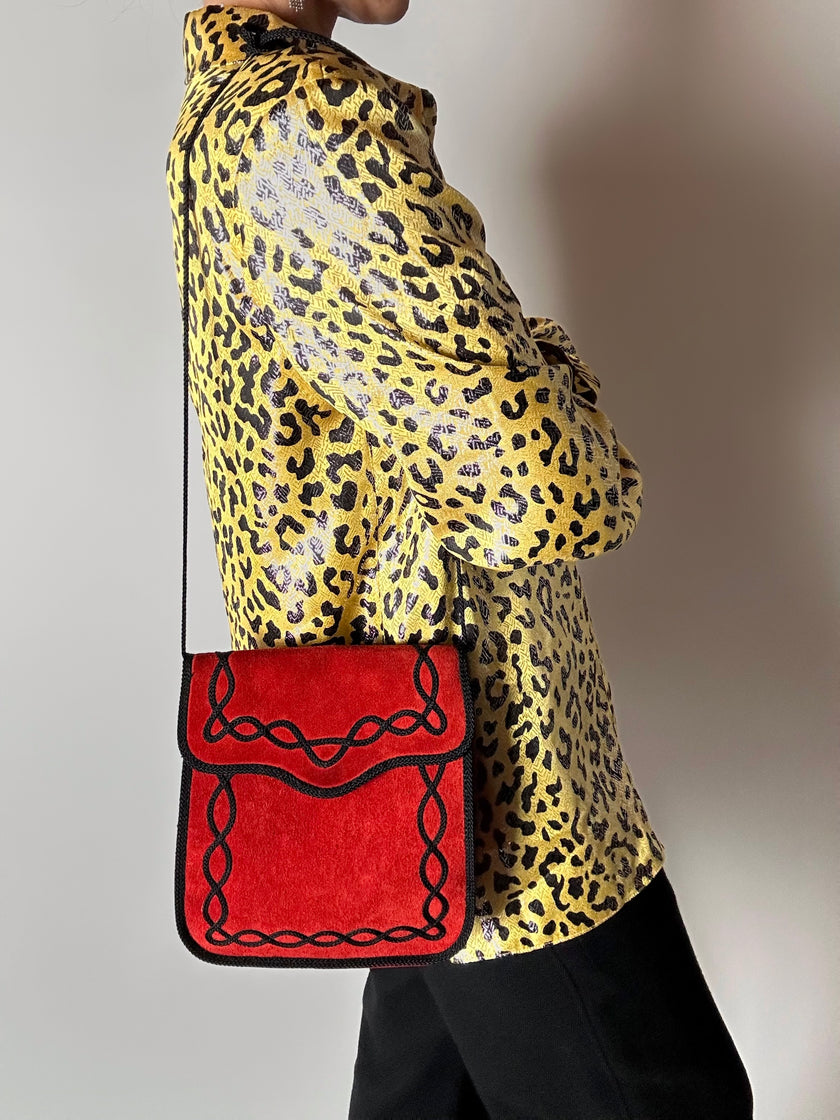 Borsa vintage Yves Saint Laurent in camoscio rosso con passamaneria nera