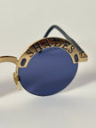 Occhiali da sole vintage Oliver Valentino con montatura gioiello dorata e lenti blu
