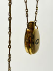 Collana vintage Gucci dorata con piccola bottiglia porta profumo