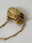 Collana vintage dorata con ciondolo a forma di bottiglia di profumo
