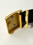 Cintura vintage Yves Saint Laurent in camoscio nero con maxi fibbia oro logata YSL