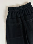 Pantaloni vintage Yves Saint Laurent Variation in lana nera a gamba ampia con tasche applicate