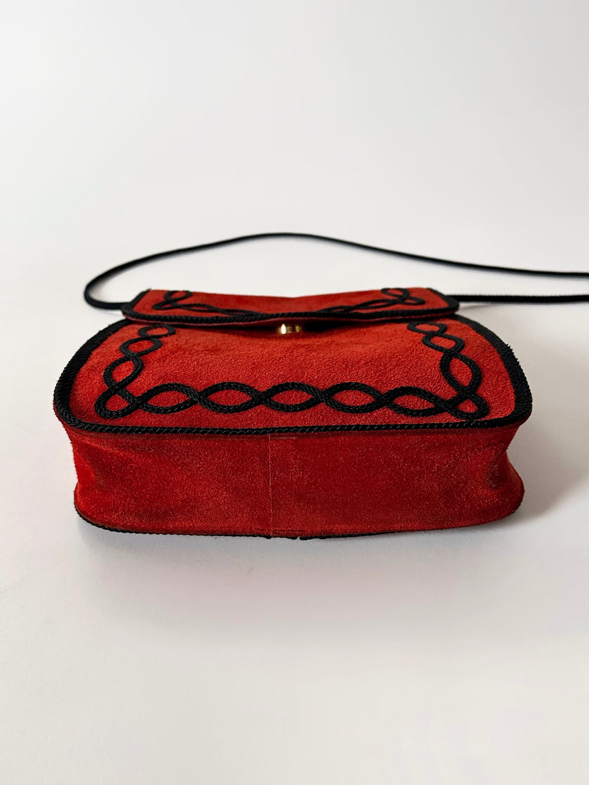 Borsa vintage Yves Saint Laurent in camoscio rosso con passamaneria nera