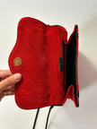 Borsa vintage Yves Saint Laurent in camoscio rosso con passamaneria nera