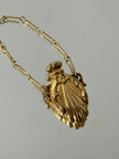 Collana vintage dorata con ciondolo a forma di bottiglia di profumo