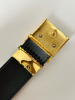 Cintura vintage Yves Saint Laurent in camoscio nero con maxi fibbia oro logata YSL