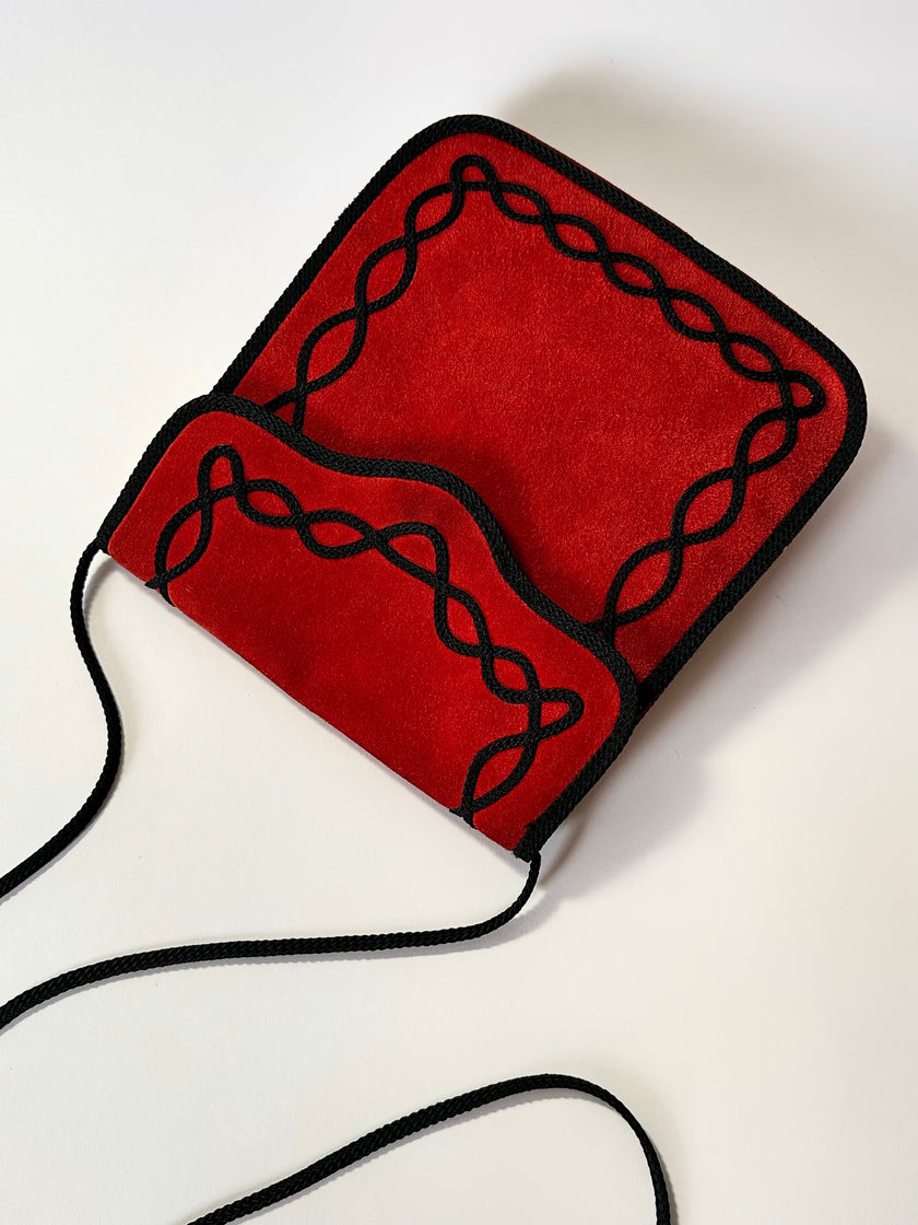 Borsa vintage Yves Saint Laurent in camoscio rosso con passamaneria nera