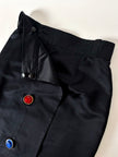 Gonna vintage Yves Saint Laurent Variation in raso nero con bottoni gioiello