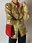 Borsa vintage Yves Saint Laurent in camoscio rosso con passamaneria nera