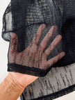 Gilet vintage lungo in rete nera con rever e spacchi laterali New Age