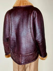 Shearling reverse in pelle liscia marrone castagno con vello caramello e ricamo sul fondo