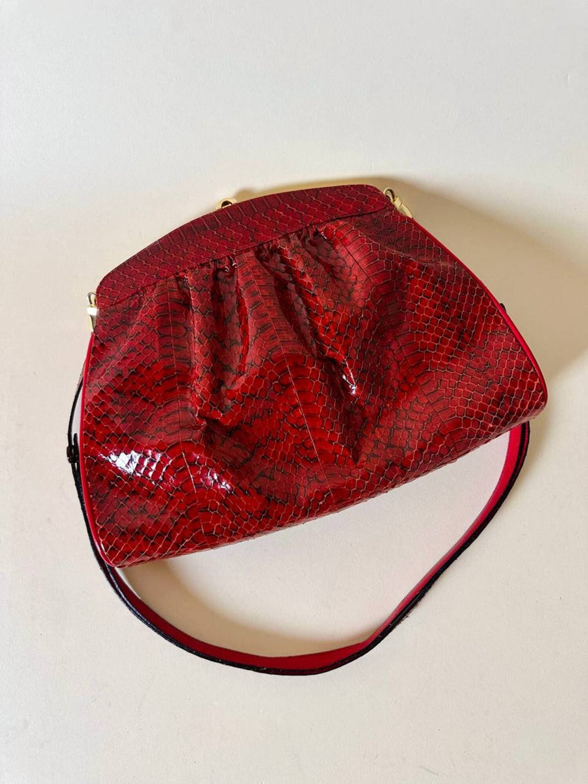 Pochette in whips rossa con tracolla regolabile