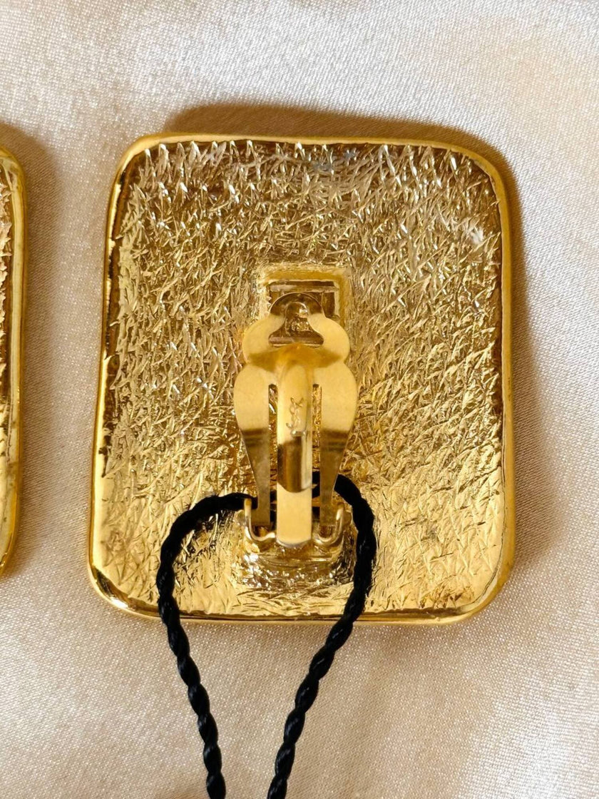Maxi clip oro con logo “Yves Saint Laurent”