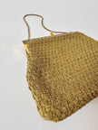 Borsa vintage Art Déco in lamé oro intrecciato con chiusura gioiello e nappa couture