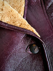 Shearling reverse in pelle liscia marrone castagno con vello caramello e ricamo sul fondo