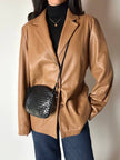 Vintage tan leather jacket with hand-stitched detailing by Claude Collections