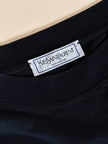 Maglia vintage Yves Saint Laurent in cotone nero con firma ricamata e bottoni dorati