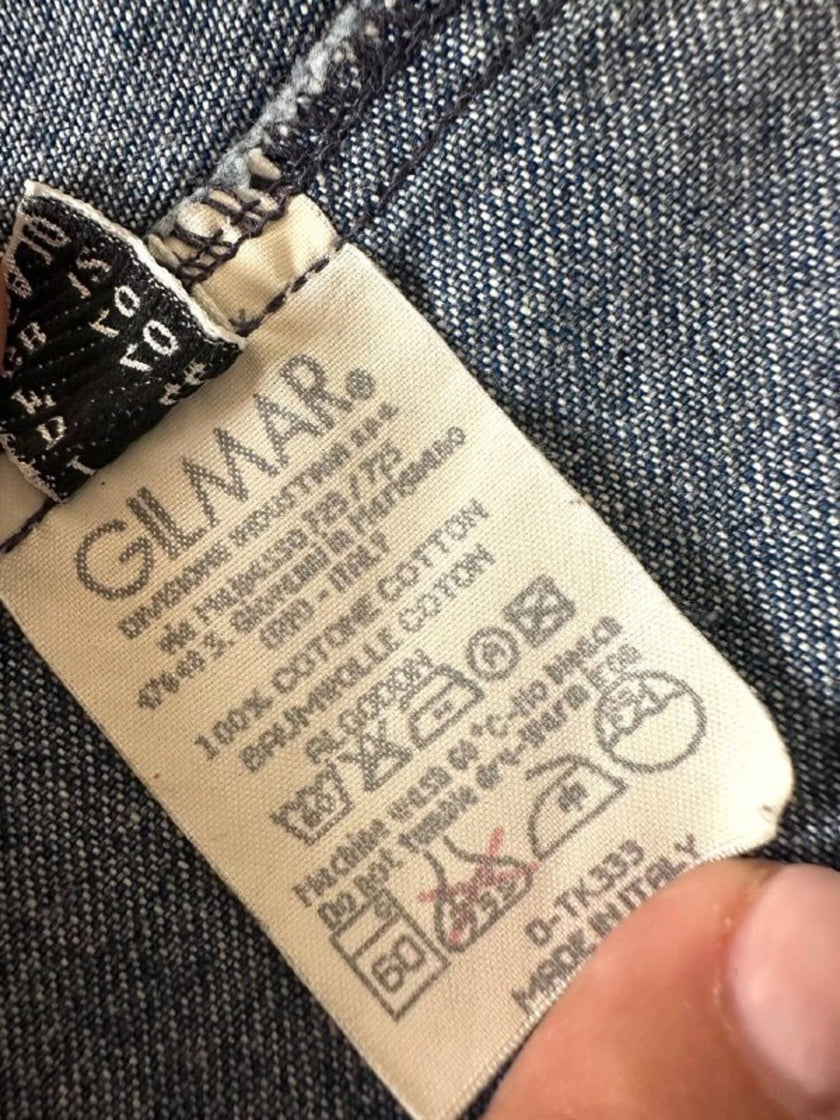 Giacca Christian Lacroix in denim modello sciancrato con lavorazione a nervature