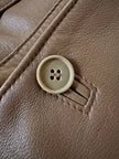 Trench doppiopetto in pelle color fango con interno imbottito