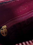 Sac à dos Must de Cartier en cuir bordeaux avec finitions dorées