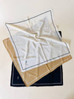 Foulard vintage Yves Saint Laurent in seta avorio con profili e logo neri