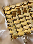 Mini bag gioiello a medaglie dorate