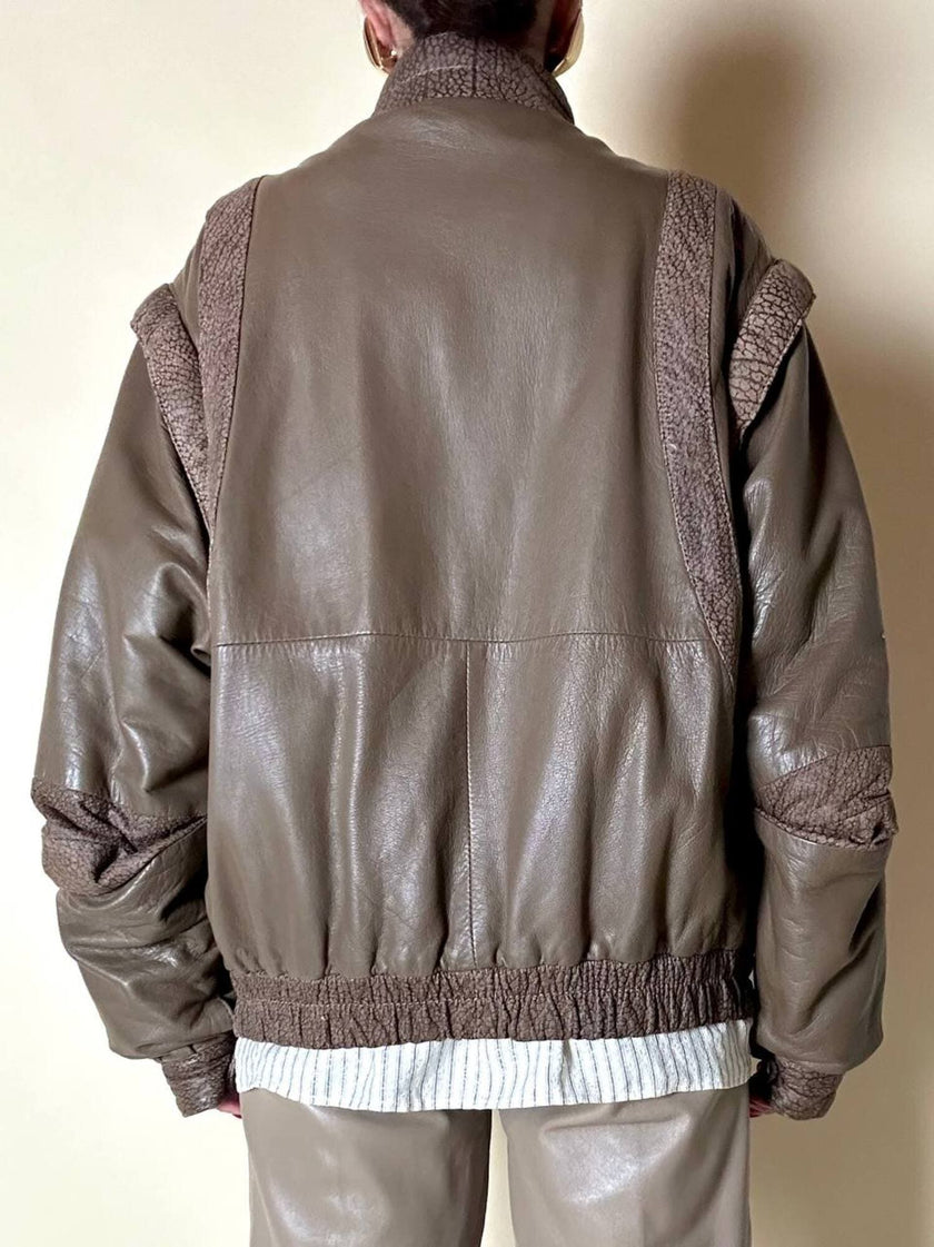 Bomber con maniche rimovibili in pelle color fango “Arpell”
