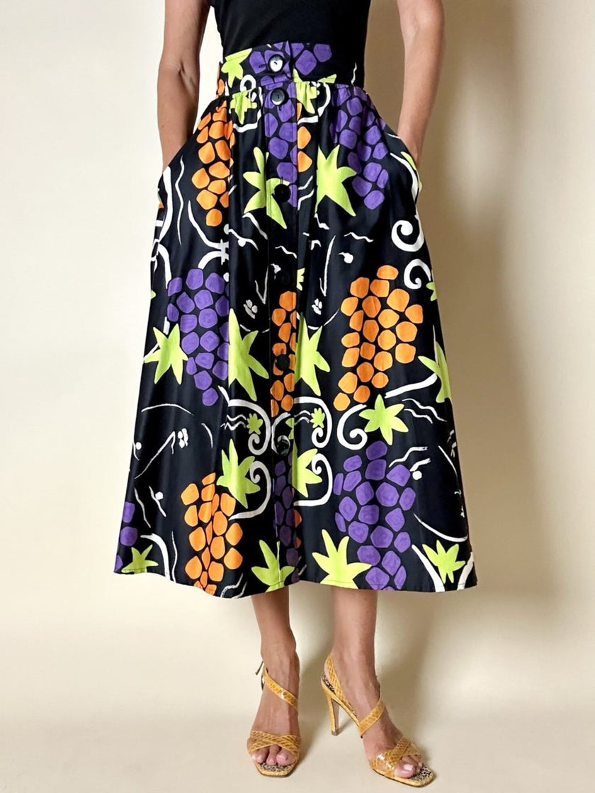 Gonna a ruota con abbottonatura frontale e fantasia a grappoli d’uva “Yves Saint Laurent”