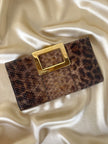 Vintage Roger Vivier leopard-print python clutch with a distinctive rectangular gold-tone metal clasp