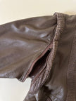 Bomber con maniche rimovibili in pelle color fango “Arpell”