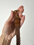 Cintura Gucci in pelle intrecciata color cuoio con fibbia oro