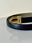 Cintura vintage Yves Saint Laurent in pelle nera con fibbia geometrica oro con logo YSL