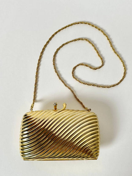 Clutch vintage in metallo dorato con motivo cannelé e chiusura serpenti De Leville