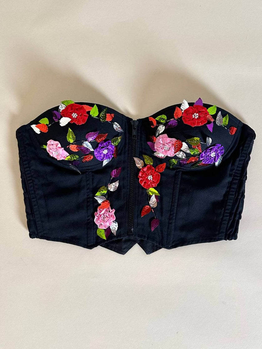 Bustier in cotone nero ricamato con fiori e paillettes e piccole coccarde multicolor “Giorgio Kauten”