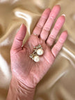 Clip con perle cabochon e piccoli fiocchi incastonati con strass “Nina Ricci”