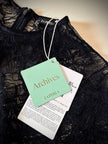 Jumpsuit con staffe in pizzo nero “La Perla”