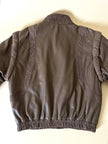 Bomber con maniche rimovibili in pelle color fango “Arpell”