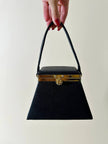 Mini bag a trapezio in ecopelle nera stampa lizard