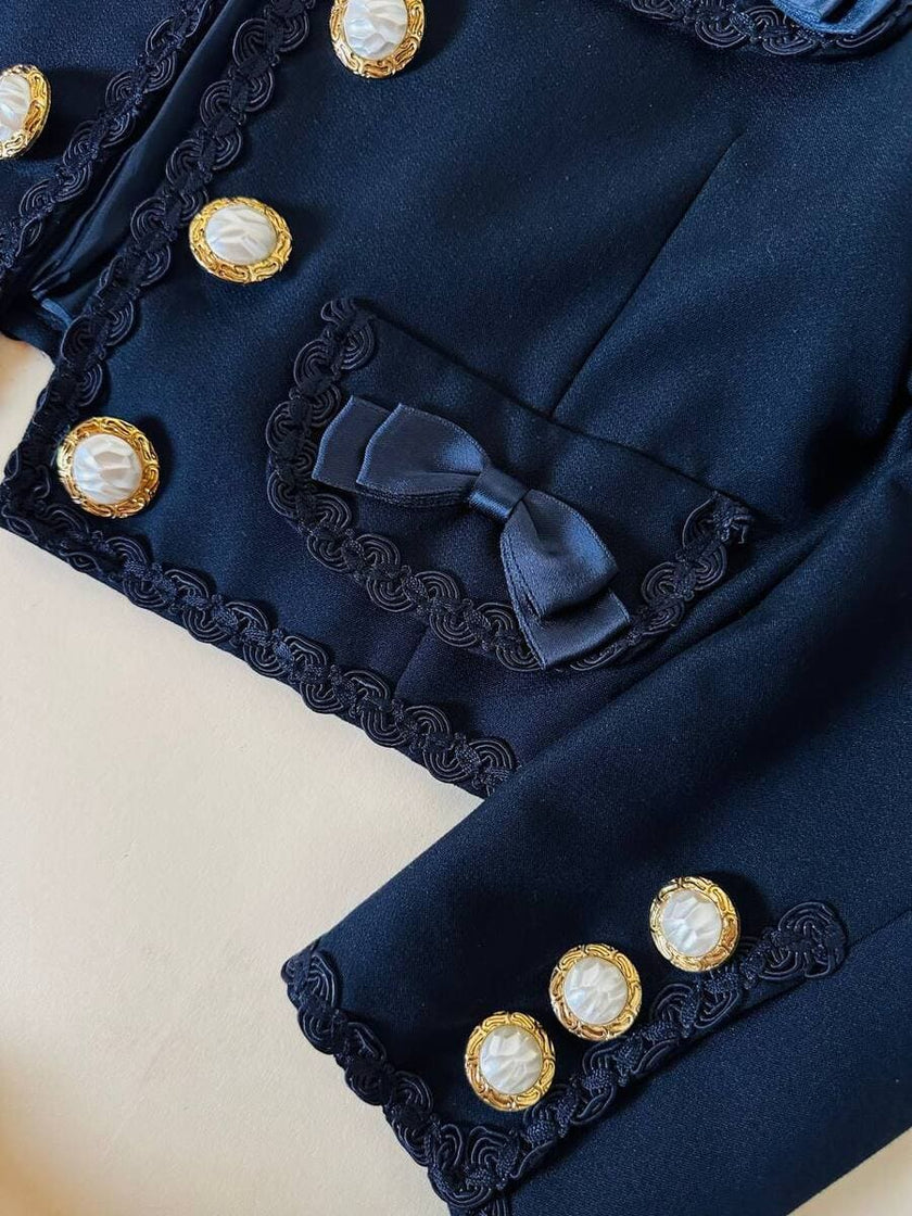 Bolero blu con bottoni gioiello e fiocchi “Max Dinè”