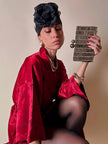 Clutch gioiello in seta nera con armatura di perline dorate “Rodo”