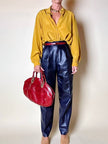 Borsa in pelle rosso bruciato con manici a treccia