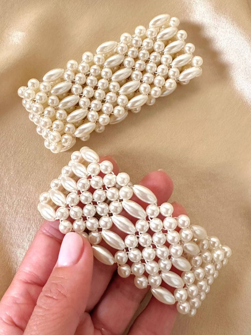 Polsiere elasticizzate di perle sintetiche bianche